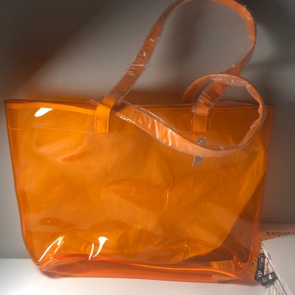 Clinique Handbags - Orange See-Through Clinique tote bag
